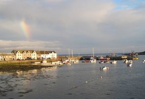 Isle of Whithorn harbour with rainbow